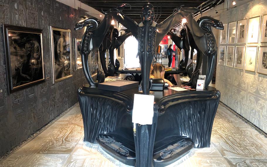 The entrance to the H.R. Giger museum is decorated with figures and art depicting his famous Xenomorph creature.