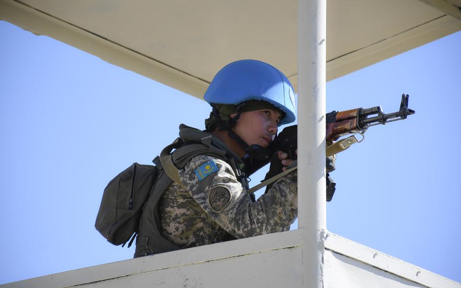 A soldier with the Kazakh ground forces' peacekeeping battalion responds to a simulated attack on his base during the U.S.-led Steppe Eagle exercise on June 25, 2019. Kazakhstan?s contributions to global peacekeeping and security efforts have increased after more than a decade of such training.