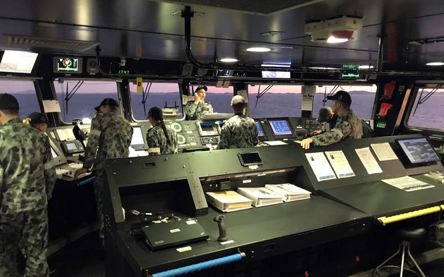 Australian sailors stand watch on the bridge of the HMAS Adelaide in the Coral Sea on Monday, July 15, 2019, during the Talisman Sabre exercise.