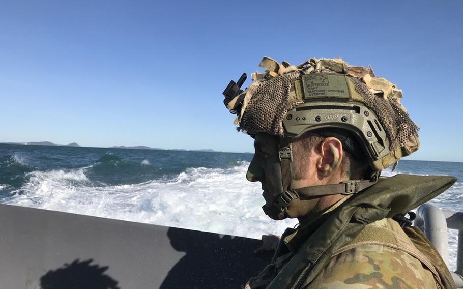 Capt. Matthew Stevens of the Australian army's 7th Infantry Regiment stands aboard a loading transport dock in the Coral Sea as soldiers prepare to practice an amphibious landing and beach assault during Talisman Sabre in Australia, Tuesday, July 16, 2019.