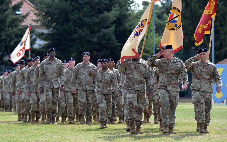 Soldiers of the 21st Theater Sustainment Command salute as they pass in review at the conclusion of the unit's change of command ceremony at Daenner Kaserne in Kaiserslautern, Germany, Wednesday, July 31, 2019. Maj. Gen. Christopher O. Mohan took the reins of the 21st TSC from Maj. Gen. Steven A. Shapiro at the ceremony.