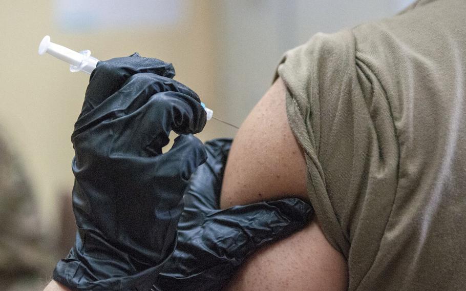 An Army nurse vaccinates a soldier in Zagan, Poland, in June 2019. About 200 Italy-based soldiers were vaccinated against the mumps virus after a soldier was diagnosed with it last week.