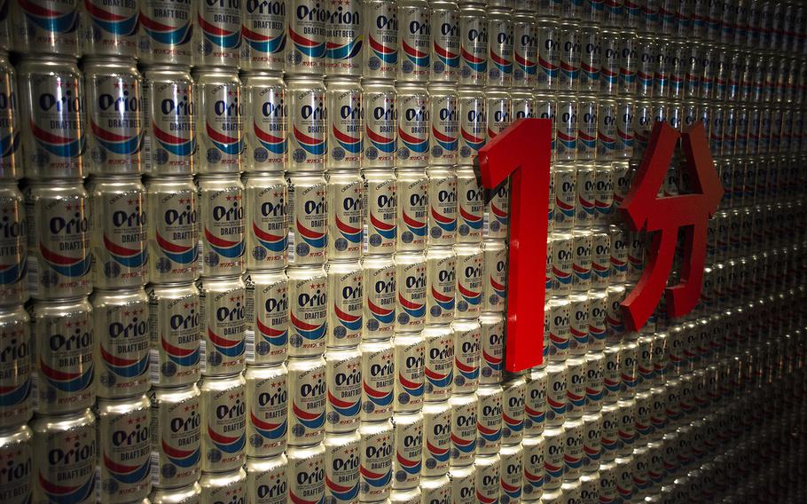 Cans of Orion beer are displayed during a tour of Orion Happy Park in Nago, Okinawa, Aug. 14, 2019.