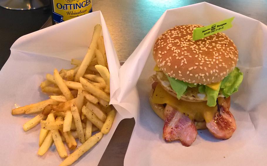 The Deluxe from Sasebo C&B Burgers is packed with bacon and stands nearly 5 inches tall.