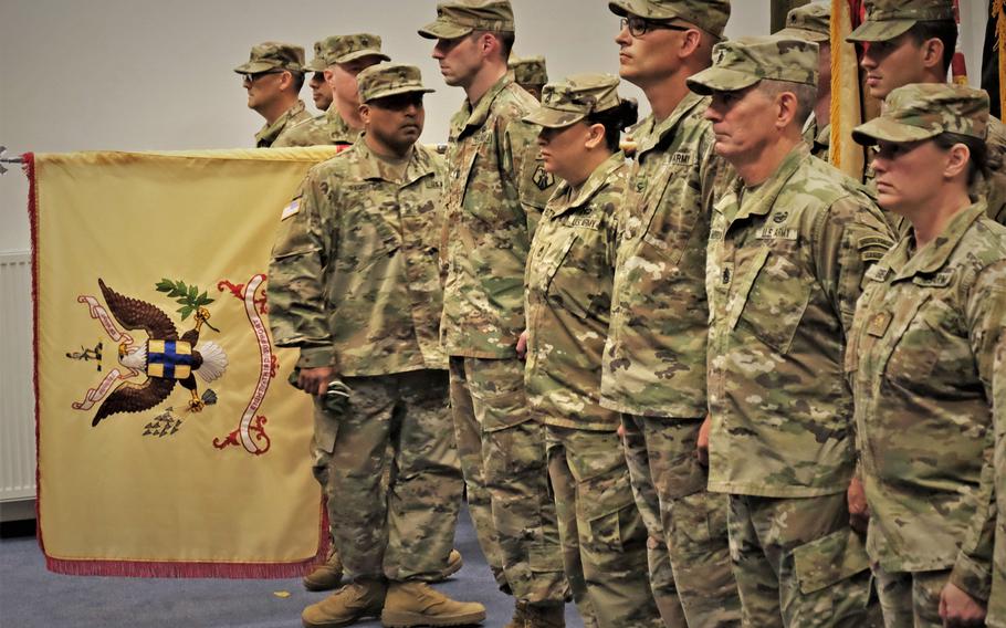 The leadership of the 83rd Combat Sustainment Support Battalion, 510th Regional Support Group, 7th Mission Support Command unfurls the unit's guidon during a ceremony held at Sembach Kaserne, Germany, Sept. 14, 2019.