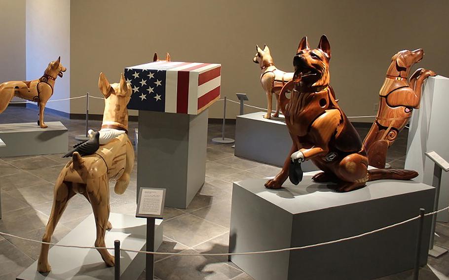 A temporary exhibit featuring Wounded Warrior Dog wooden sculptures by artist James Mellick will be on display at the National Museum of the U.S. Air Force from Nov. 8, 2019 through Jan. 31, 2020.
