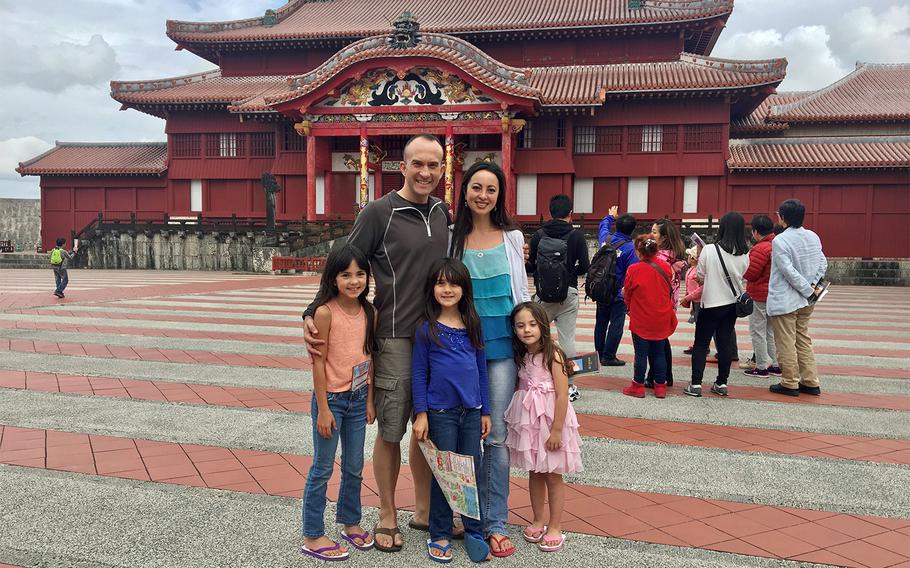 Marine Corps Maj. Indigo Gregory and his wife, Mari Gregory, pose with their daughters at Shuri Castle in Naha, Okinawa, in this undated photo.