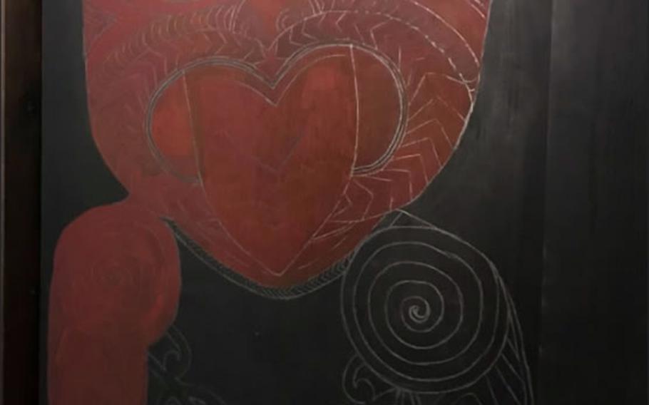 There are plenty of reminders of Kiwi heritage at the +64 Cafe in Tokyo, including a large painting of what looks like a Taniwha – a supernatural being that, according to some of New Zealand's indigenous Maori people, lives in rivers or caves.