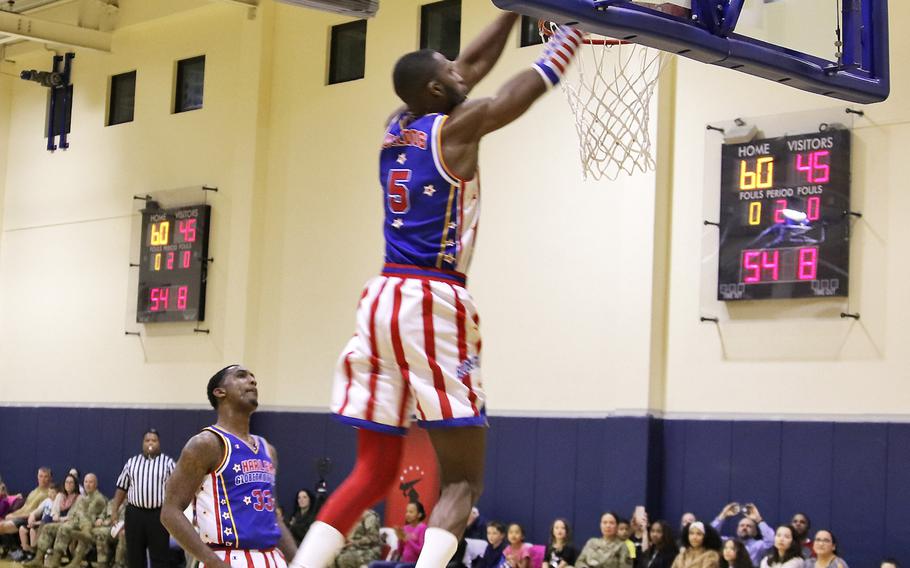 Harlem Globetrotter Bulldog Mack dunks during a game at the Dragon Fitness Center, Aviano Air Base, Italy, Nov. 12, 2019.