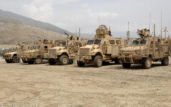 Mine Resistant Ambush Protected (MRAP) vehicles stand in a row before going out on a mission in eastern Afghanistan. A whistleblower case alleges that a defense contractor, Navistar, bilked the Pentagon out of more than $1 billion on a contract to build MRAP vehicles. 



