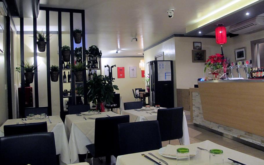 The dining room at Cicchetteria Cinese Zhu in Vicenza is done in classic black, white and red. The service is helpful and friendly.