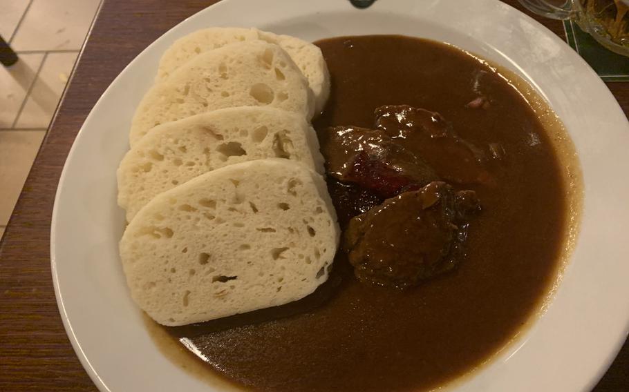 A traditional Czech dish of wild boar with rosehip sauce and bread dumplings was a filling main course at Na Spilce restaurant, in the Pilsner Urquell brewery's old fermentation room.