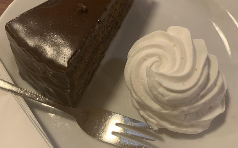 Sacher torte served with a dollop of whipped cream is one of three desserts offered at Na Spilce, the restaurant in the old fermentation room at the Pilsner Urquell brewery in Pilsen, Czech Republic. The cake is a bit dry but goes nicely with the signature pilsen on tap.