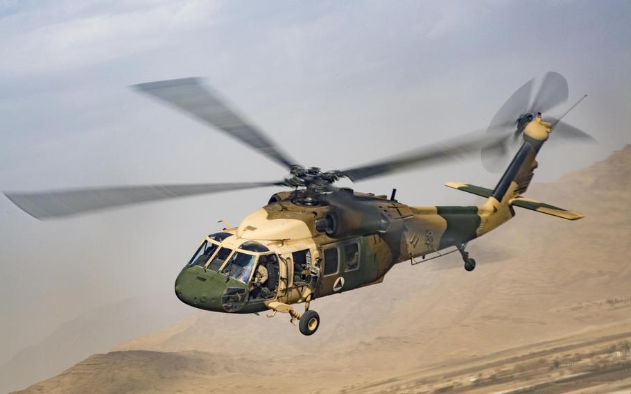 An Afghan Air Force UH-60 Black Hawk flies during a NATO-led mission in Afghanistan in 2018. The U.S. is providing less money and fewer Black Hawks and advisers to the Afghan air force.
