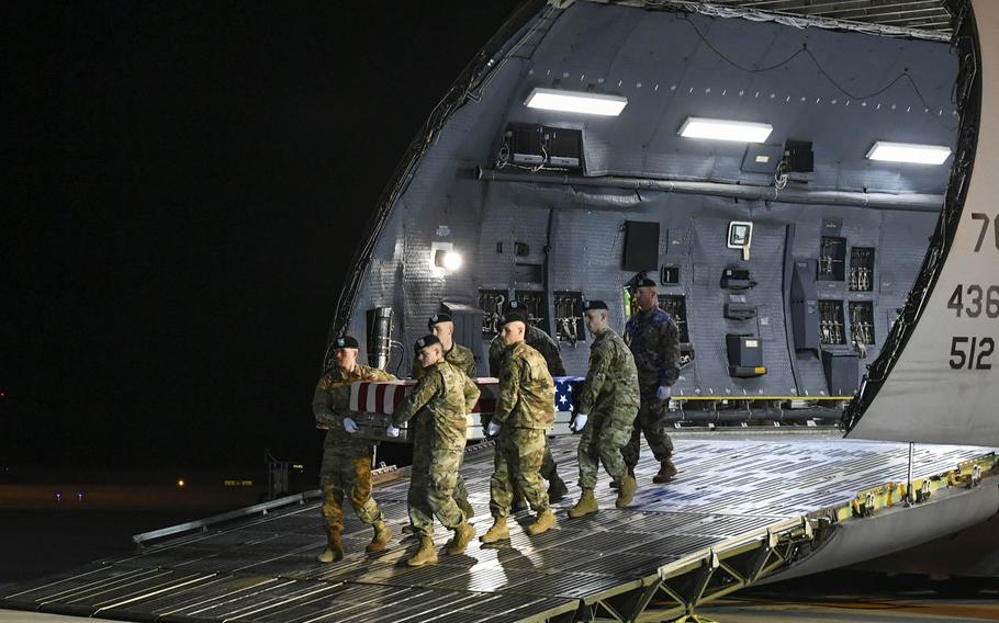 An Army carry team transfers the remains of Spc. Antonio Moore, Jan. 28, 2020 at Dover Air Force Base, Del. Moore died Jan. 24, 2020, in Syria during a vehicle rollover accident while conducting route clearance operations as part of Operation Inherent Resolve.