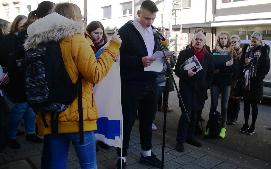 German high school students from the Westpfalzrealschule Weilerbach read out biographies of the Strauss family during the laying of a Stolperstein in their memory on Wednesday, February 5, 2020, in Kaiserslautern, Germany. Kaiserslautern has 152 brass Stolpersteine - literally "stumble stones" - which tell brief stories of people like the Strausses, who were were among millions of Jews who were victimized by Germany's Nazi regime.