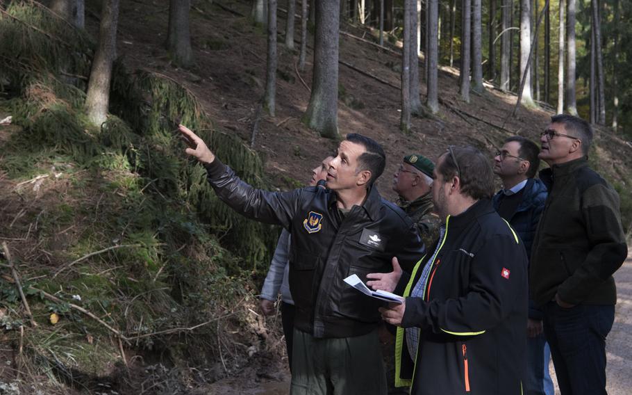 U.S. Air Force Col. Jason Hokaj, 52nd Fighter Wing vice commander, and German community leaders visit the site near the German city of Trier where an F-16 fighter jet crashed on Oct. 8, 2019. A partial power failure combined with bad weather caused the jet to crash,the Air Force said Tuesday.