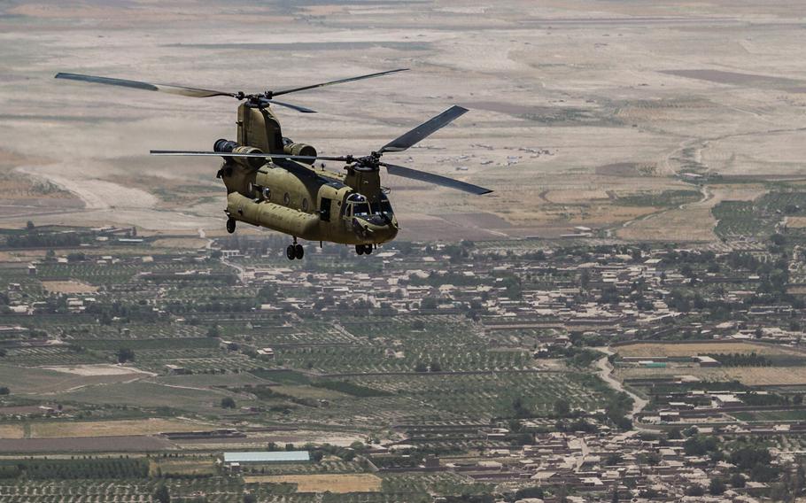 A U.S. Army Reserve CH-47 Chinook helicopter flies over Helmand Province, Afghanistan, in June 2017. The Pentagon plans to send 20 Chinook helicopters to Afghan special forces, according to a Pentagon brief.