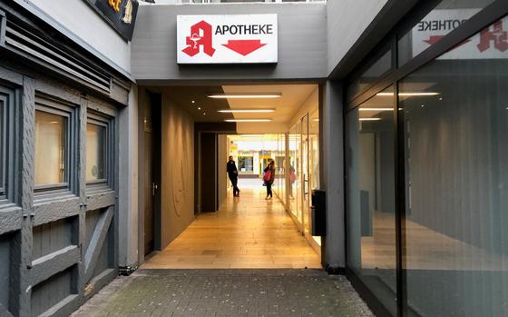 Two people maintain their social distance as they hold a conversation in a deserted pedestrian area in Kaiserslautern. The head of the Army's 21st Theater Sustainment Command said Friday that those who don't obey German restrictions could face government fines and military punishment.

