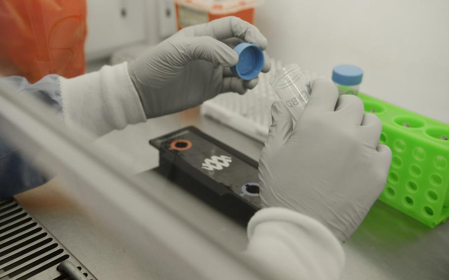 Tech. Sgt. Jordan Rigor, 48th Medical Support Squadron, conducts coronavirus testing at RAF Feltwell, England, April 9, 2020. Being able to process tests locally has reduced the wait time for results from 5 to 7 days to less than 24 hours.