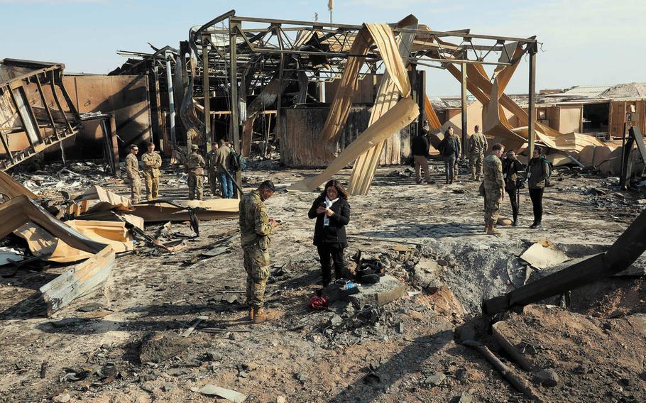 Media outlets visit one of the many impact sites created by the missile attacks at al Asad Air Base, Iraq, Jan. 13, 2020. Commanders at al Asad had to decide who would stay on base during the attack, which came with little warning, and who would be evacuated to carry on operations, a report released by the Air Force on Tuesday, April 21, 2020, shows.
