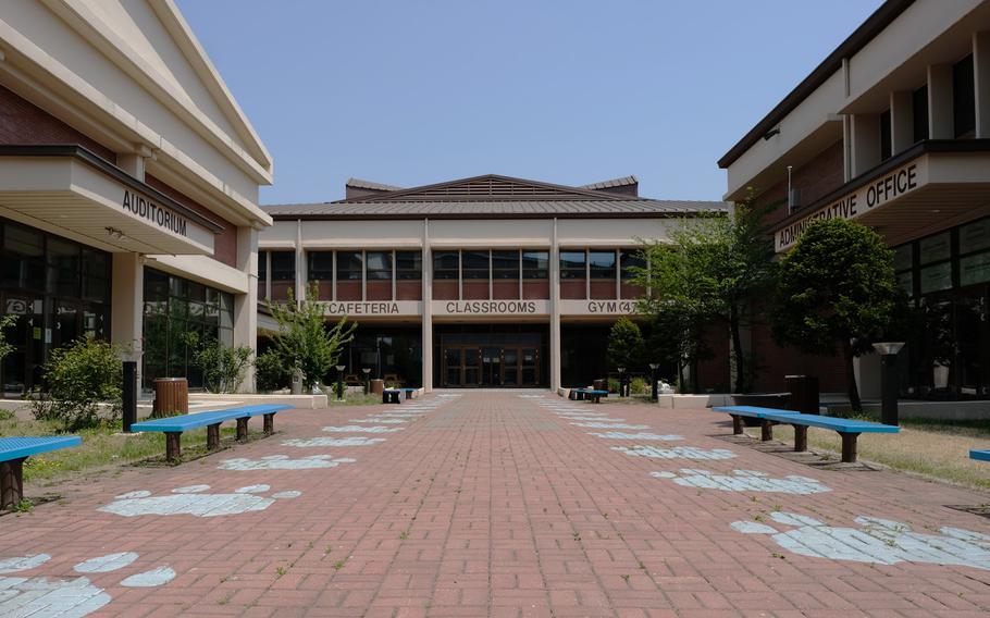 The courtyard, often crowded by teenagers at lunchtime, was empty at the shuttered middle-high school at Osan Air Base, South Korea, Wednesday, April 29, 2020.