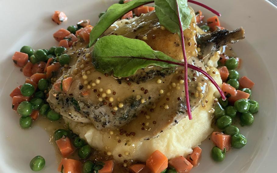 Tender chicken on a bed of mashed potatoes, drizzled with gravy and served with vegetables, is an excellent choice at the Yachtova restaurant in Mikolajki, Poland, May 31, 2020.