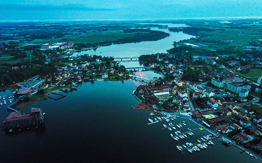 An aerial shot, taken with a drone, of the town of Mikolajki, Poland, in the country's northeastern lake district. Lake Mikolajskie is in the foreground and Yachtova restaurant is at the bottom left of the picture.