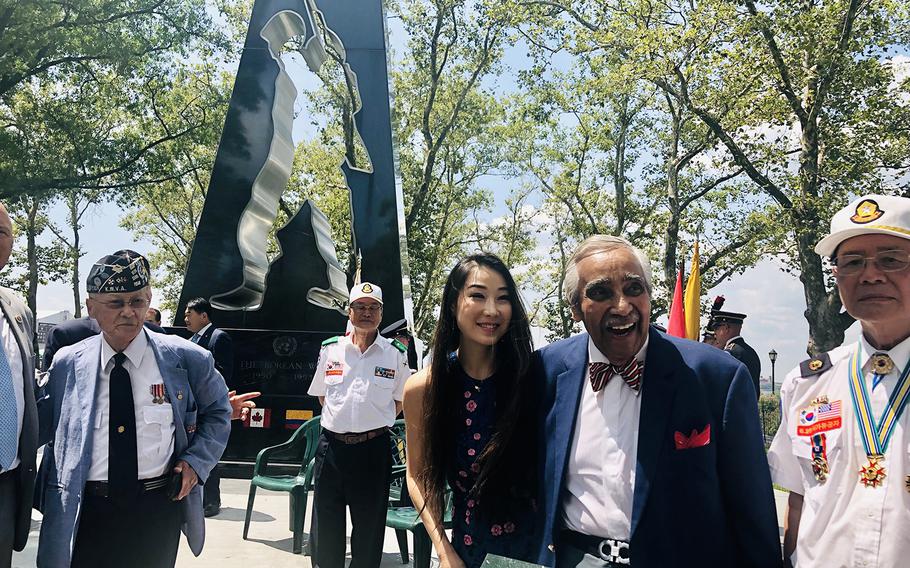 Hannah Kim with Korean War veteran and former congressman Charlie Rangel at the New York Korean War Veterans Memorial.