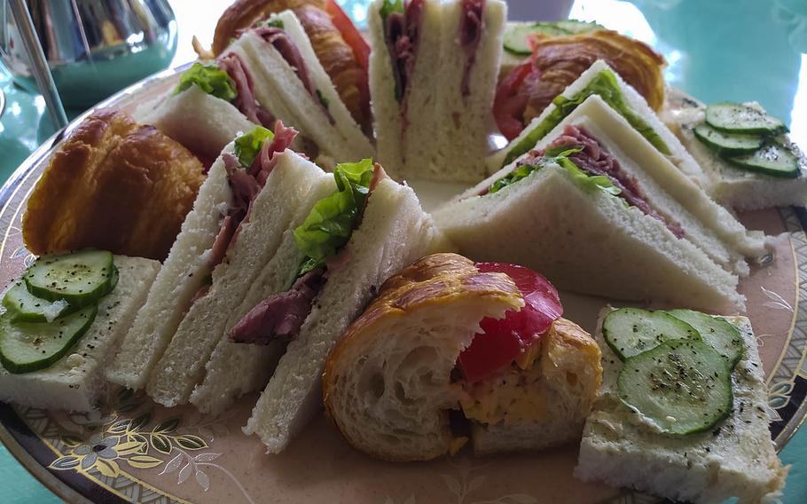 Cucumber sandwiches and croissants stuffed with pastrami, pimento and tomato are among the savory choices offered with the Princess Heather set at Rose Town Tea Garden in Ome, Japan.