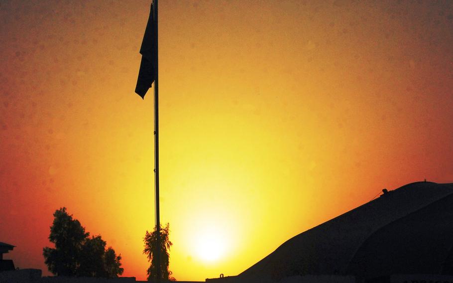 The sun sets over Forward Operating Base Fenty, Afghanistan, in this file photo. Military contractor Fluor Corp. was ordered to cease providing many services at the base near the city of Jalalabad, according to a memo issued June 22, 2020, as part of coronavirus prevention measures.