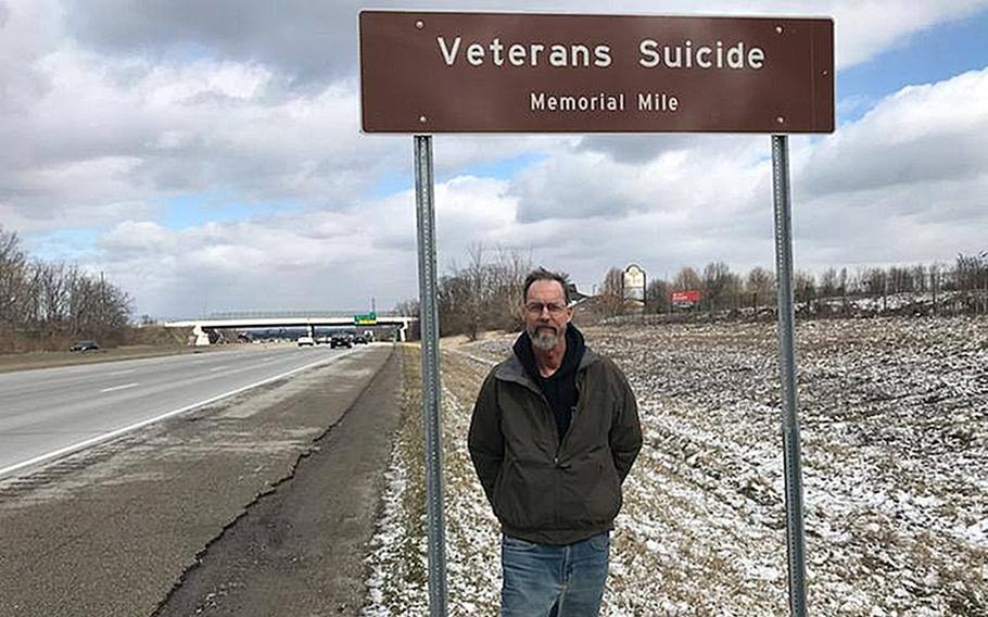 Howard Berry at mile marker 22 on I-71 in Ohio, designated as Veterans Suicide Memorial Mile. Berry, who spent seven years working to get a Purple Heart for his son and sought to raise awareness about veteran suicide, died last month after a battle with cancer.