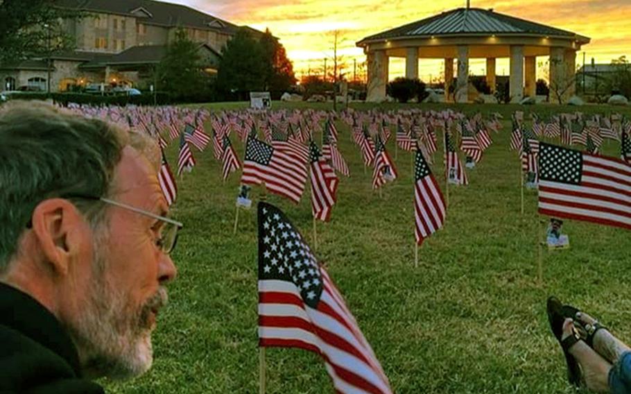 Howard Berry sits among rows of American flags. The ''Flags for Forgotten Soldiers'' initiative was a brainchild of Berry, a Cincinnati, Ohio, man who lost his son, Army Staff Sgt. Joshua Berry, to suicide. Berry died last month after a battle with cancer.