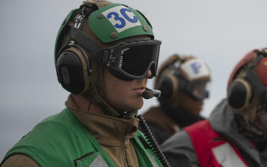 Chief Petty Officer Justin Calderone observes flight operations on the flight deck of the aircraft carrier USS Theodore Roosevelt while participating in Exercise Northern Edge in May 2019. Calderone died July 2, 2020, following a medical emergency aboard the ship.