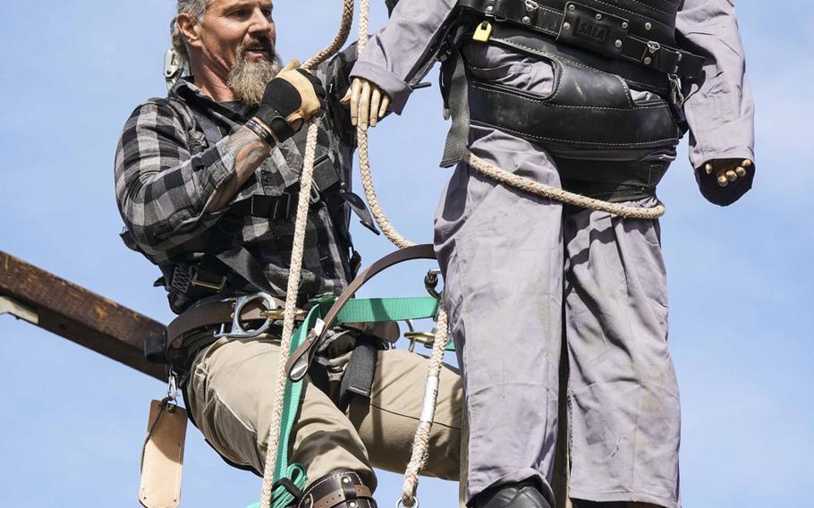 Marine veteran Kelly Murphy, left, competes on the reality show Tough As Nails, which debuts on CBS television on Wednesday, July 8, 2020. The competition celebrates everyday Americans who roll up their sleeves and get their hands dirty to accomplish a task and keep the U.S. running, CBS says on its website.