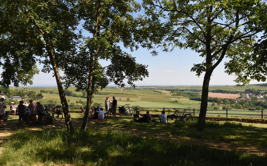 Hikers rest and enjoy the panaromic view at the ''wine rest with a view'' in Moelsheim, a quaint wine village along the Zellertalweg trail in Rheinland-Pfalz, Germany.
