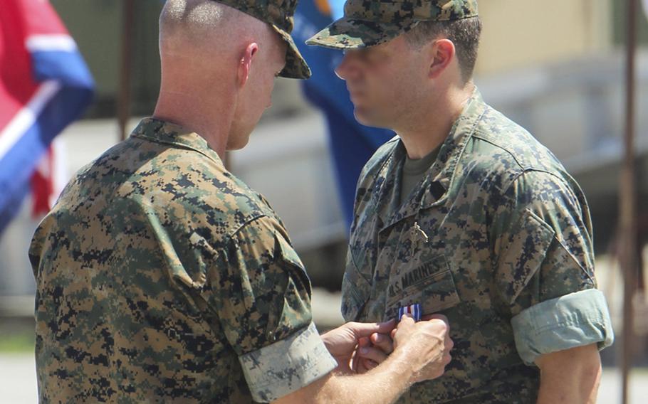 A Marine Raider, whose face was blurred in this photo by the service, was awarded the Silver Star Medal for heroic actions while deployed to Afghanistan in 2019, at a ceremony at Camp Lejeune, N.C., July 10, 2020.