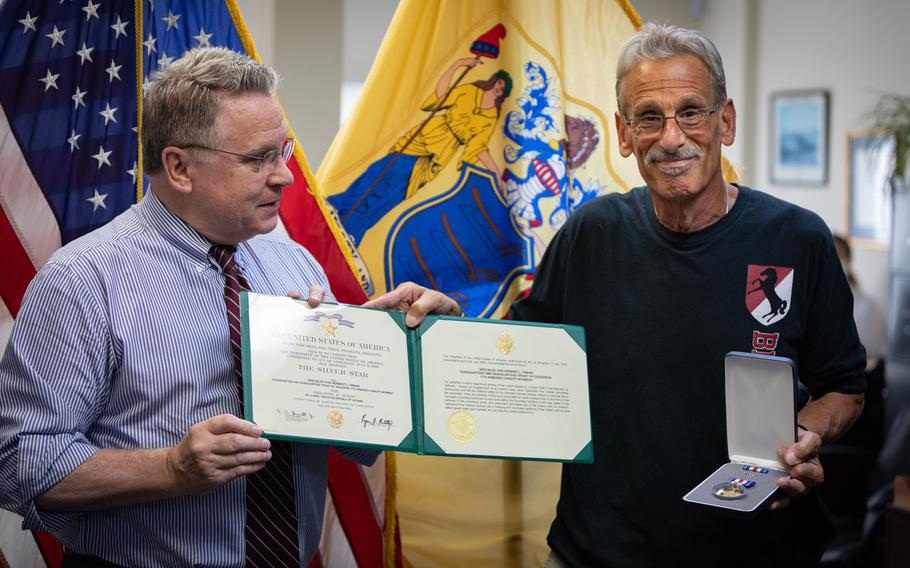 Rep. Chris Smith, left, presents Vietnam War veteran Bart ''Doc'' Fabian with his second Silver Star at a ceremony in Smith's office in Freehold, N.J., July 18, 2020. Fabian earned the medal for saving the lives of 10 fellow soldiers in a battle on April 13, 1969.