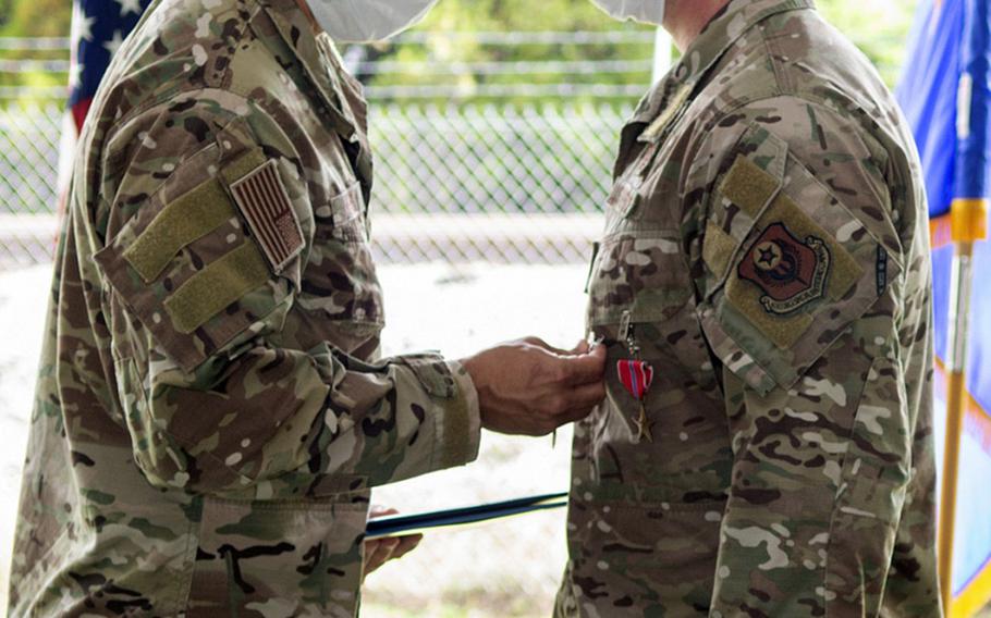 A Bronze Star Medal is presented to an Air Force Special Tactics operator from The 21st Special Tactics Squadron assigned to Pope Field, N.C. The squadron held a ceremony July 24, 2020, to present over 90 awards for the squadron's most recent deployment in 2019.