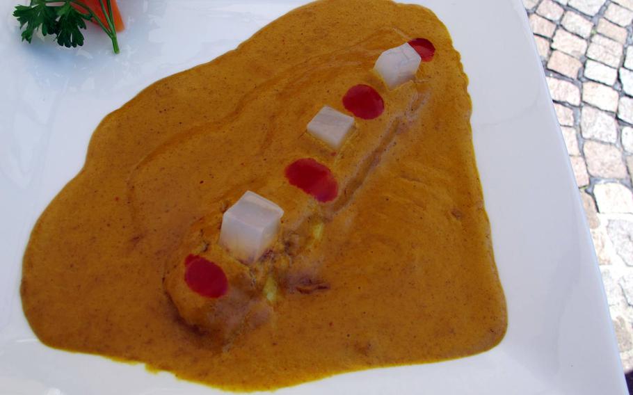 Is this seabass at Furai Japanese Restaurant in Vicenza swimming in curry sauce or drowning in it? The white cubes are lychee.