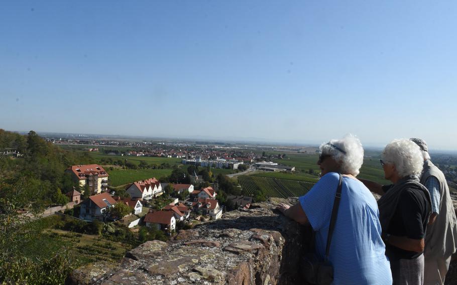 Walkers look out over the Rhine Valley from a perch on the hillside village of Neuleiningen, Germany, one of the many villages along the Pfalz Wine Trail. The second leg of the route is the longest, from Neuleiningen to Bad Duerkheim, a walking distance of about 11 miles.
