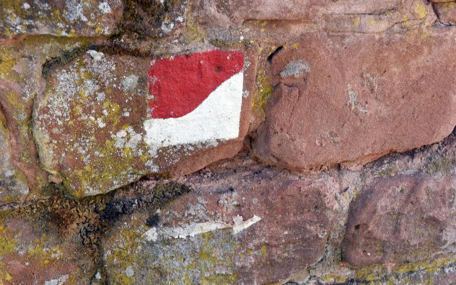 When hiking Germany's Pfalz Wine Trail, look for these red-and-white markings, which can be found on trees, rocks and other landmarks along the 105-mile hiking path.