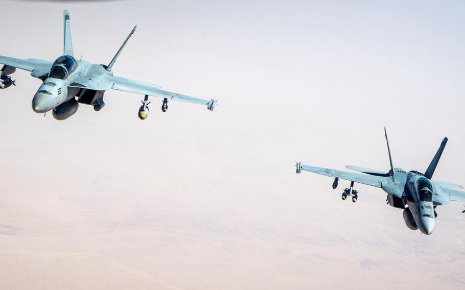 A pair of F/A-18F Super Hornets from Carrier Air Wing 17, USS Nimitz. For the first time in nearly 2 1/2 years, jets launched from an aircraft carrier conducted an airstrike against Islamic State targets in support of Operation Inherent Resolve, the global coalition battling the terrorist group in Iraq and Syria.