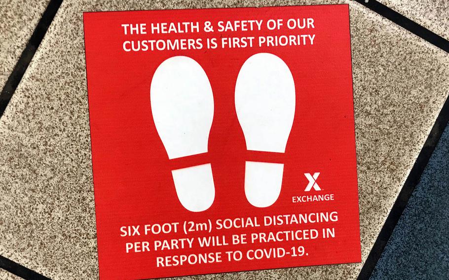 A floor decal reminds food court patrons to practice social distancing at Kadena Air Base, Okinawa, May 20, 2020.