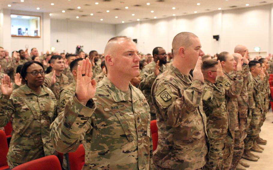 First Sgt. Joseph N. Buck Jr., 1173rd Deployment and Distribution Support Battalion, 595th Transportation Brigade, recites the noncommissioned officer creed alongside other soldiers during an NCO induction ceremony at Camp Arifjan, Kuwait, Feb. 9, 2019. Many NCOs, primarily in the ranks from staff sergeant through master sergeant, will be able to rank their desired next assignments under a new program.