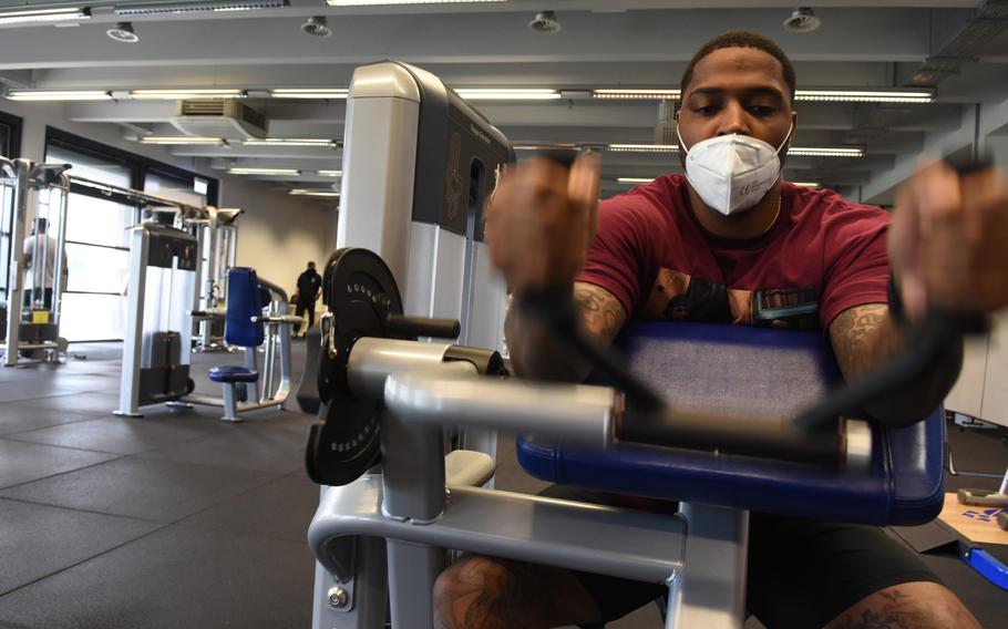 Army Staff Sgt. Kenric Duncan, 31, works his triceps on a machine Monday, June 15, 2020, at the Southside Fitness Center on Ramstein Air Base, Germany. As new restrictions take effect in Germany Nov. 2, several on-base gyms will remain open for active-duty personnel.