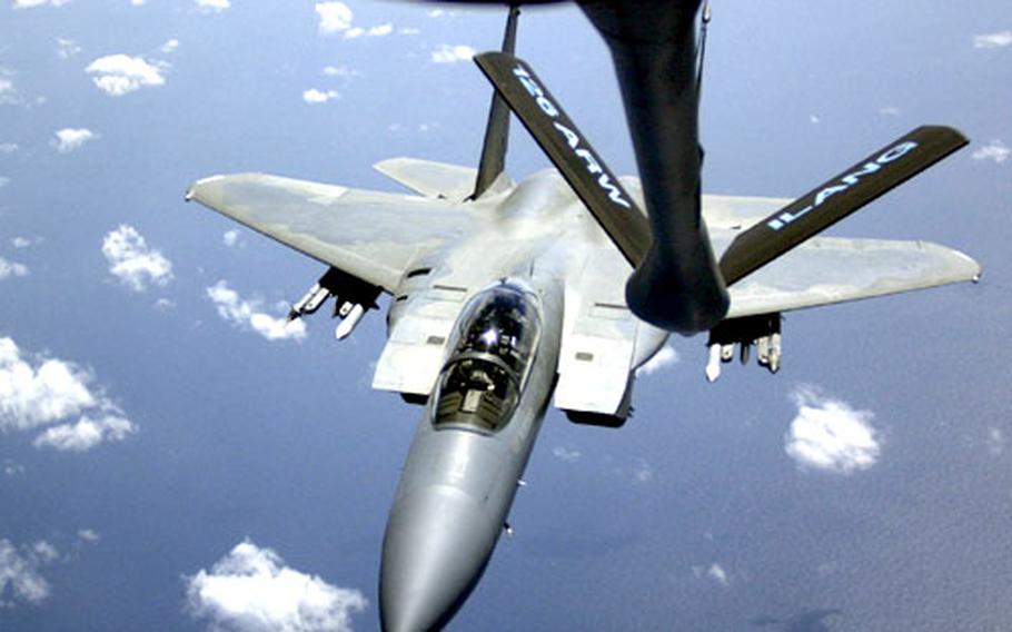 An F-15 lines up for refueling from a KC-135 aircraft off Okinawa’s coast Tuesday.