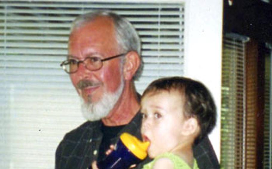 William Blair visits his grandson in June 2003, shortly after his first Iraq deployment as a Defense Intelligence Agency employee. 