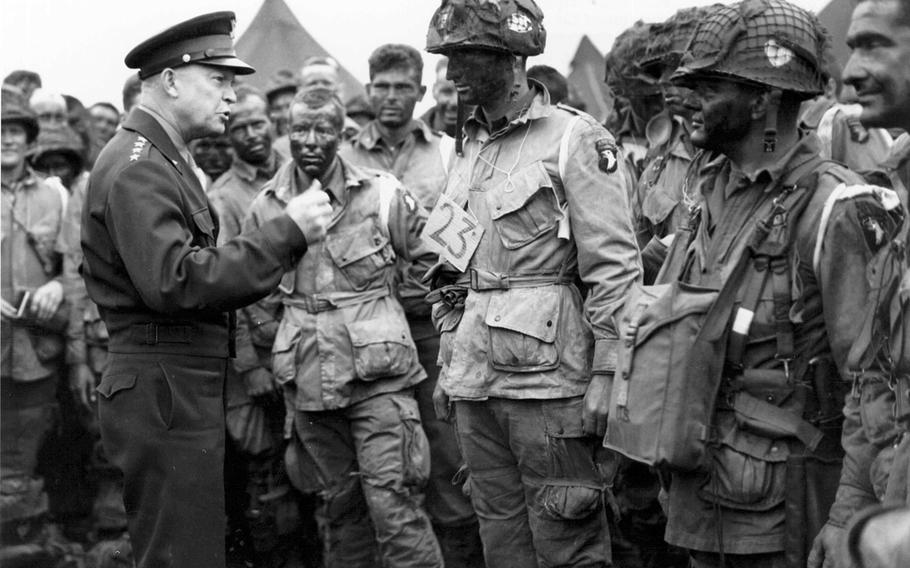 Gen. Dwight D. Eisenhower gives the order of the day, “Full victory — nothing else,” to paratroopers in England just before they board their airplanes to participate in D-Day.