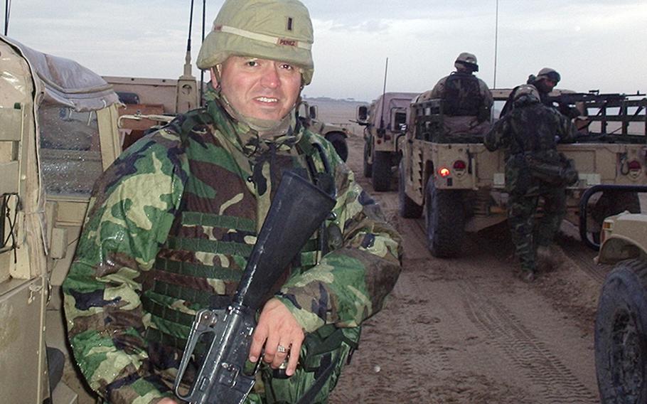 Capt. Edward Perez, then a first lieutenant, moving across the berm from Kuwait into Iraq for the first time in 2004.   